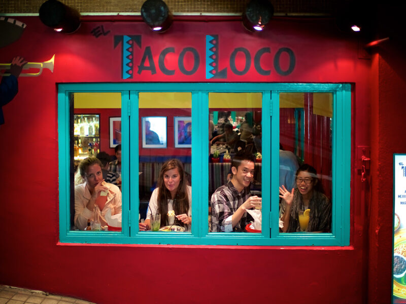 Taco Frames four people looking out a window